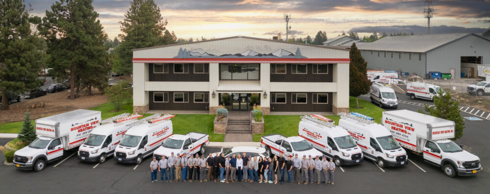 company group photo with company trucks/vans