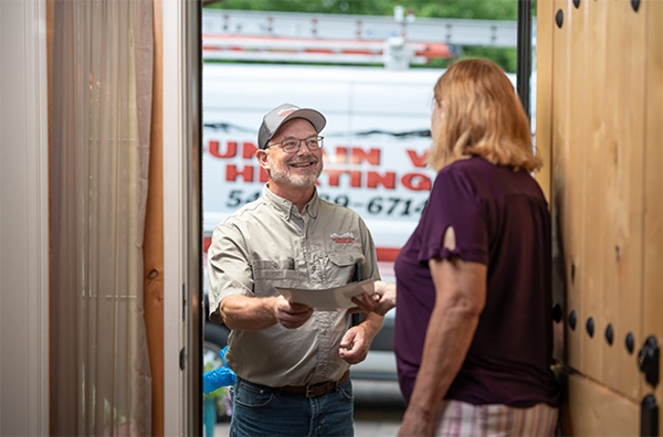 employee greeting customer at door